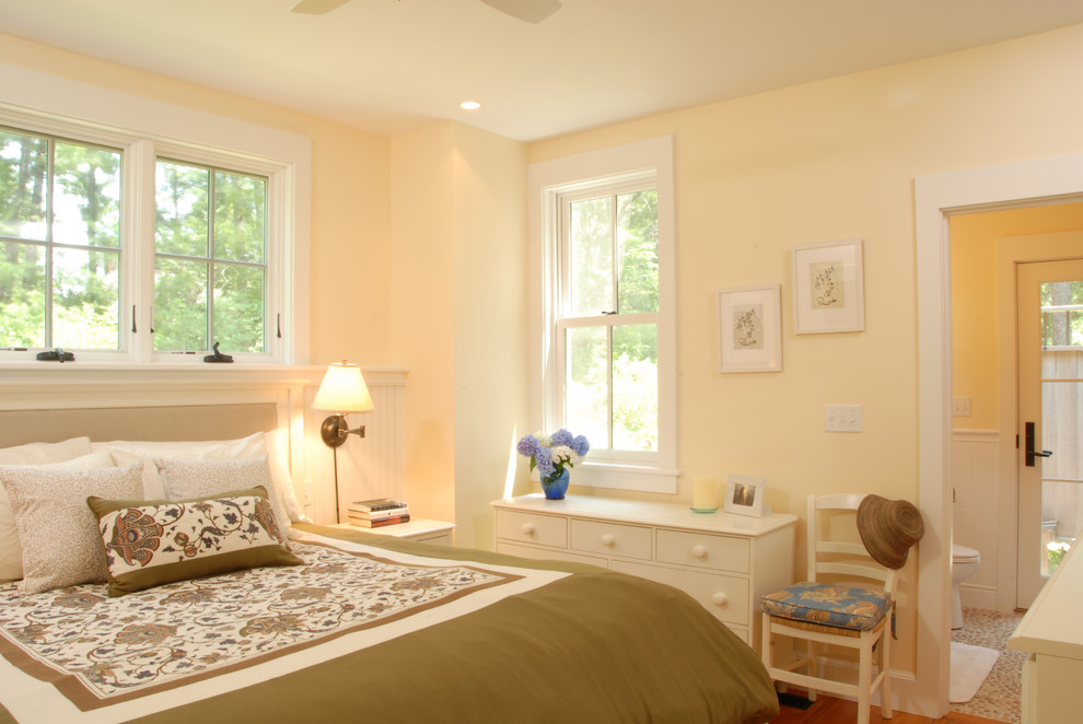 Photo of a traditional bedroom in Boston with beige walls.