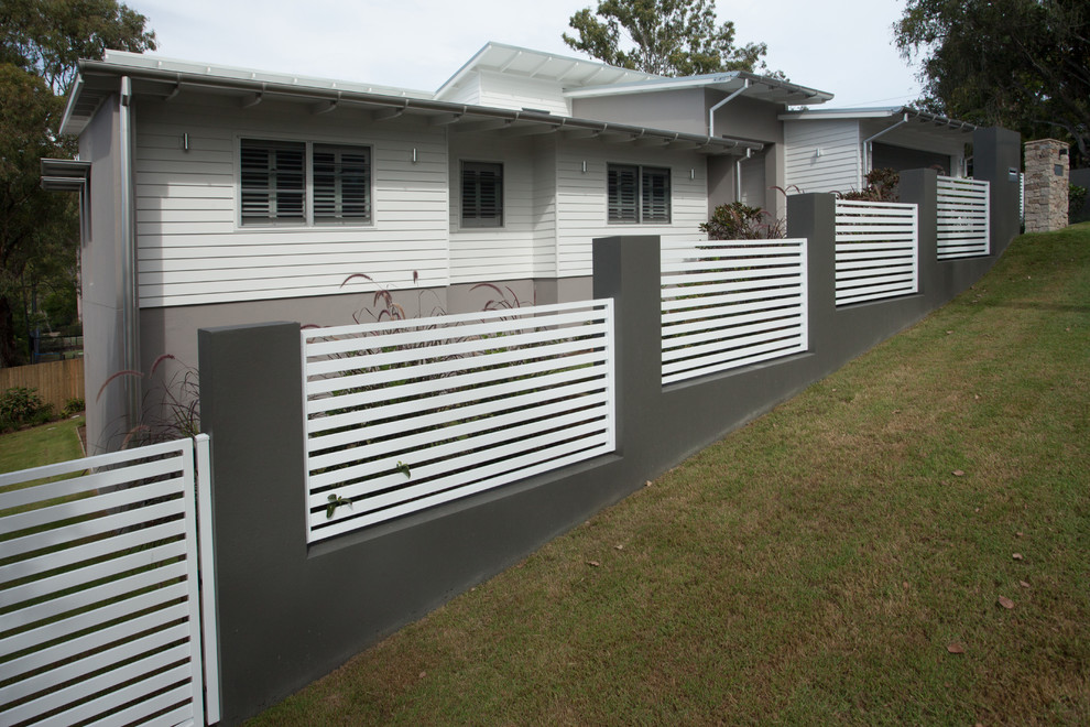 Mid-sized trendy home design photo in Brisbane