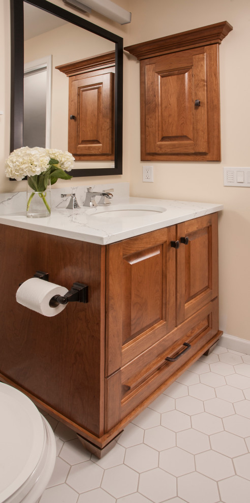 Small traditional master bathroom in Seattle with furniture-like cabinets, medium wood cabinets, an alcove shower, a two-piece toilet, blue tile, subway tile, yellow walls, ceramic floors, an undermount sink, engineered quartz benchtops, white floor, a hinged shower door and white benchtops.