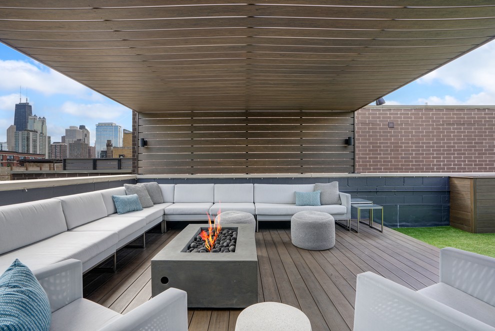 Contemporary rooftop and rooftop deck in Chicago with a fire feature and a pergola.