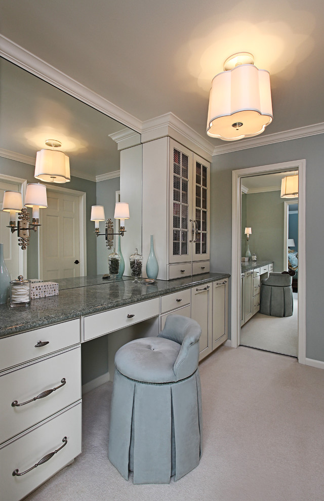 This is an example of a large traditional master bathroom in Detroit with glass-front cabinets, white cabinets, grey walls and granite benchtops.