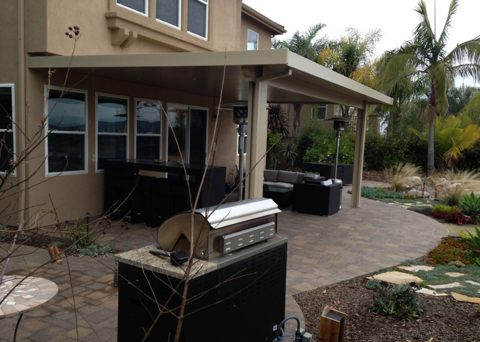 Large transitional backyard patio photo in San Diego with a fire pit and no cover