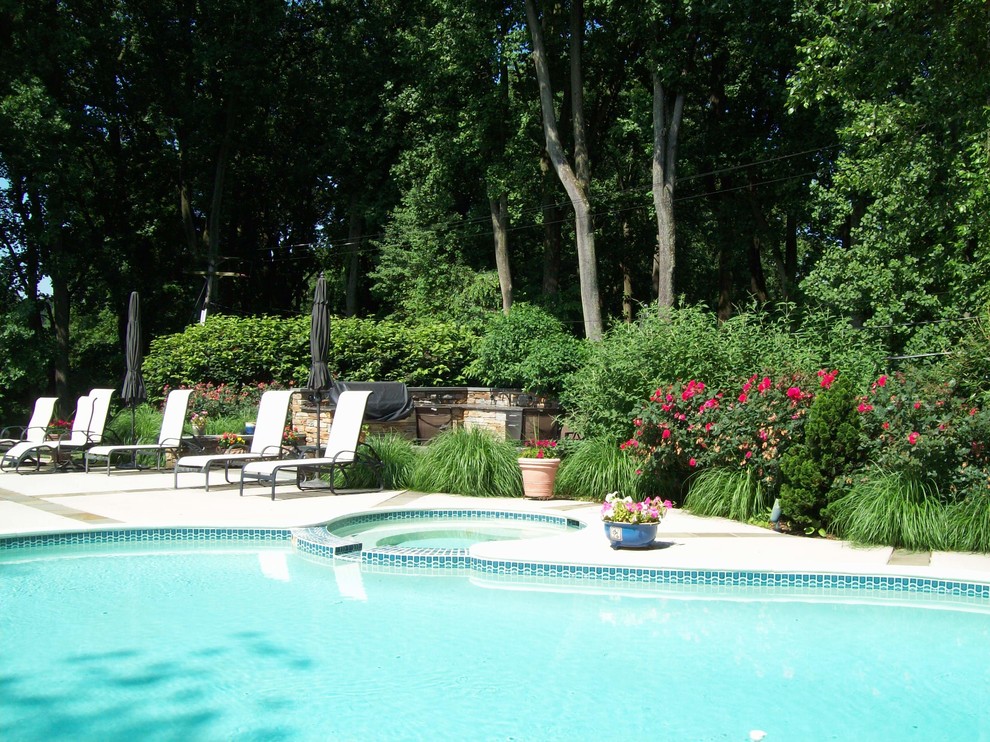 Large transitional backyard concrete pool photo in Baltimore
