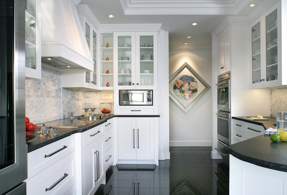 Inspiration for a small transitional galley eat-in kitchen in Other with glass-front cabinets, white cabinets, granite benchtops, grey splashback, mosaic tile splashback, stainless steel appliances, marble floors, a peninsula and an undermount sink.