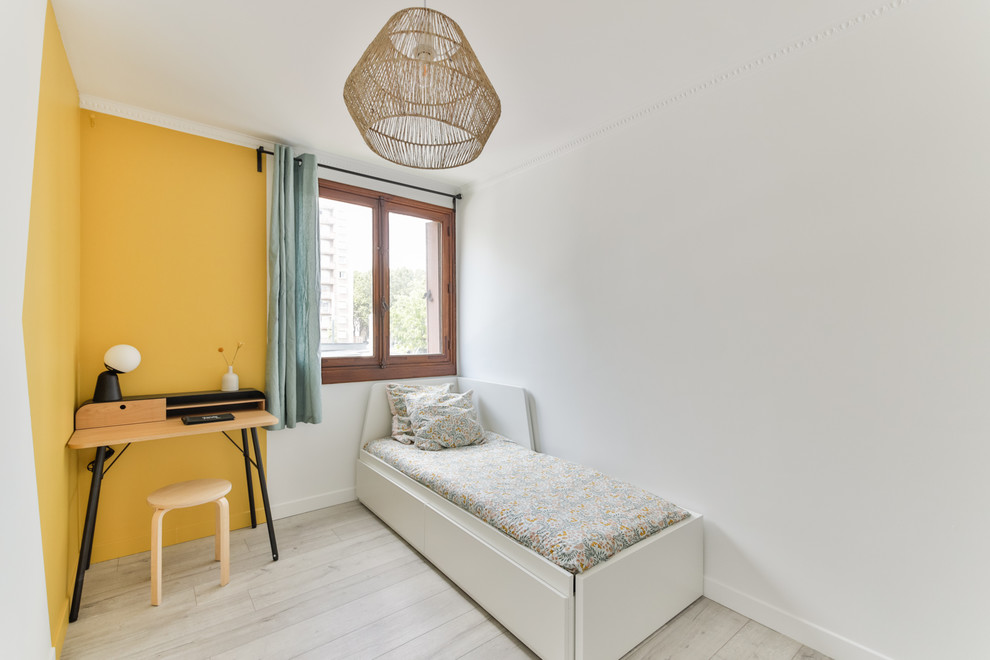 Mid-sized scandinavian bedroom in Marseille with yellow walls, linoleum floors, no fireplace and beige floor.