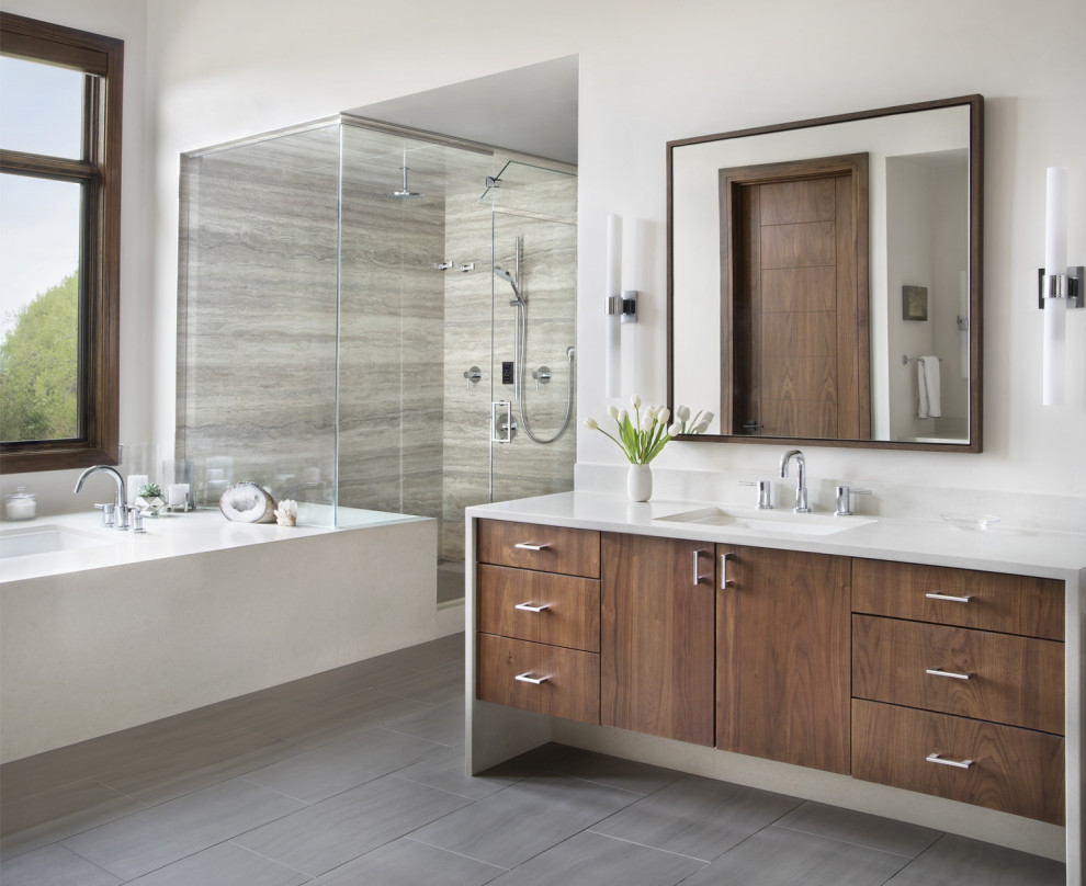 Design ideas for a mid-sized contemporary master wet room bathroom in Denver with flat-panel cabinets, medium wood cabinets, a drop-in tub, white tile, white walls, dark hardwood floors, an undermount sink, engineered quartz benchtops, a hinged shower door, white benchtops, a single vanity and a built-in vanity.