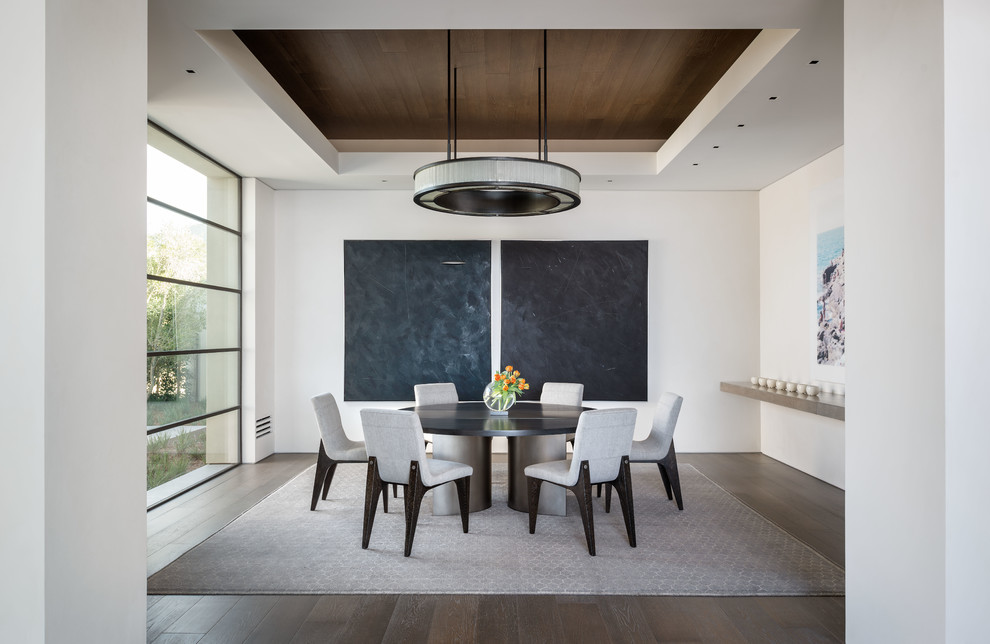 Design ideas for a contemporary dining room in San Diego with white walls and dark hardwood floors.