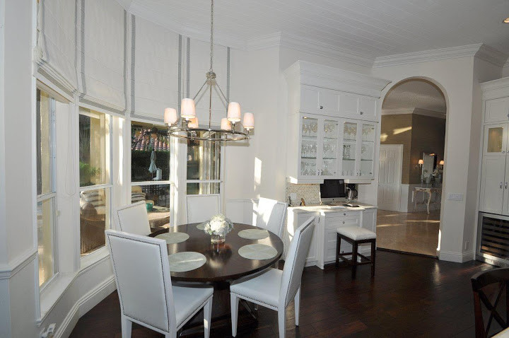 This is an example of a transitional dining room in Miami.