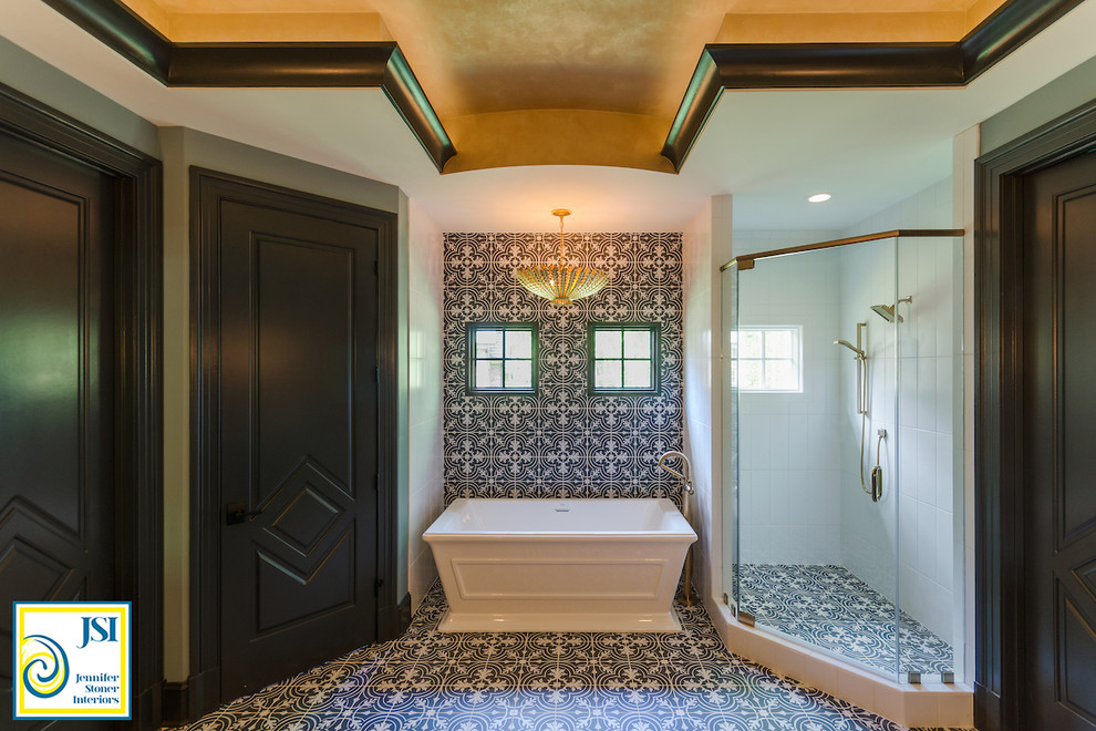 Design ideas for a mid-sized transitional master bathroom in Richmond with furniture-like cabinets, grey cabinets, a freestanding tub, a corner shower, a one-piece toilet, black and white tile, porcelain tile, blue walls, porcelain floors, an undermount sink and marble benchtops.