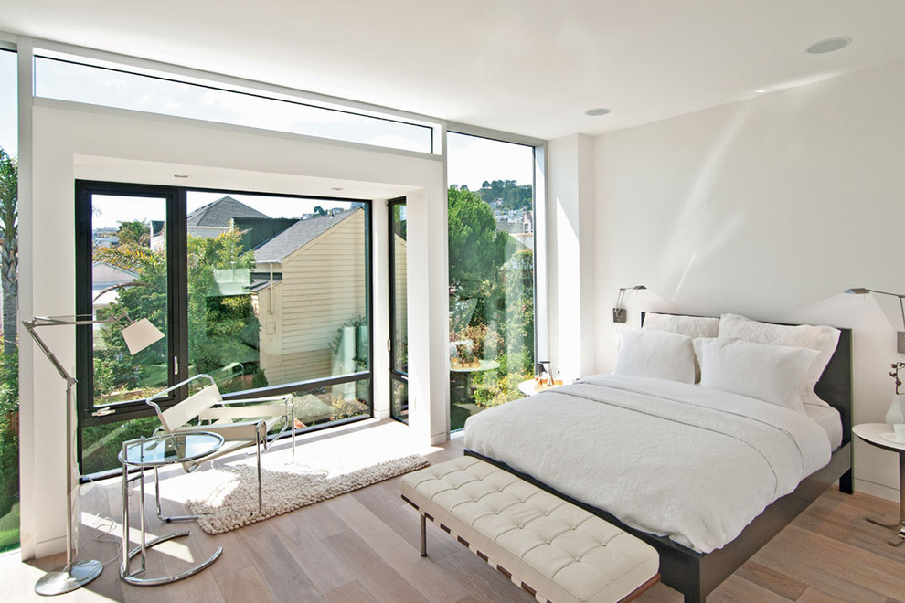 This is an example of a modern bedroom in San Francisco with white walls.