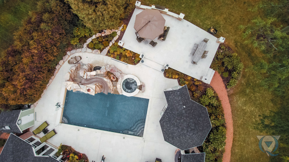 Water slide - large rustic backyard rectangular lap water slide idea in Chicago