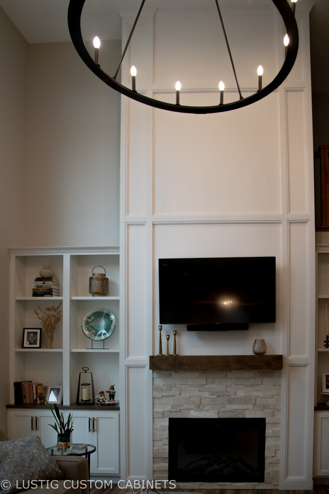 Inspiration for a large transitional l-shaped laminate floor and brown floor open concept kitchen remodel with an undermount sink, flat-panel cabinets, white cabinets, quartz countertops, white backsplash, ceramic backsplash, stainless steel appliances, an island and white countertops