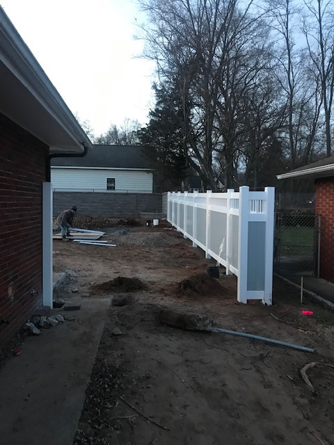 Fence installation after patio and retaining wall