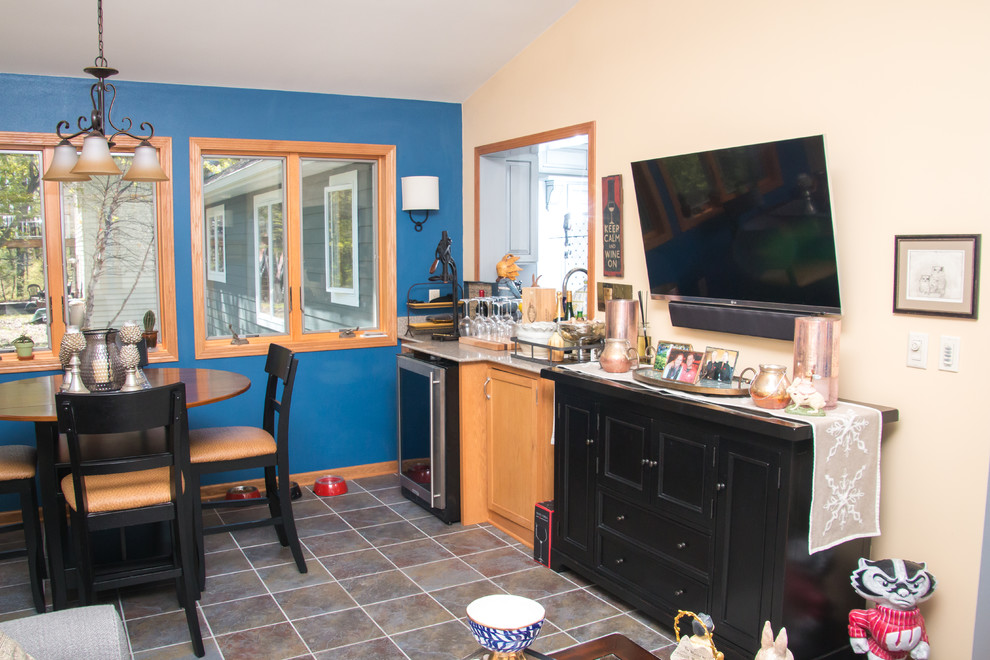 Eat-in kitchen - large transitional u-shaped porcelain tile and beige floor eat-in kitchen idea in Milwaukee with an undermount sink, raised-panel cabinets, gray cabinets, granite countertops, white backsplash, marble backsplash, stainless steel appliances and no island