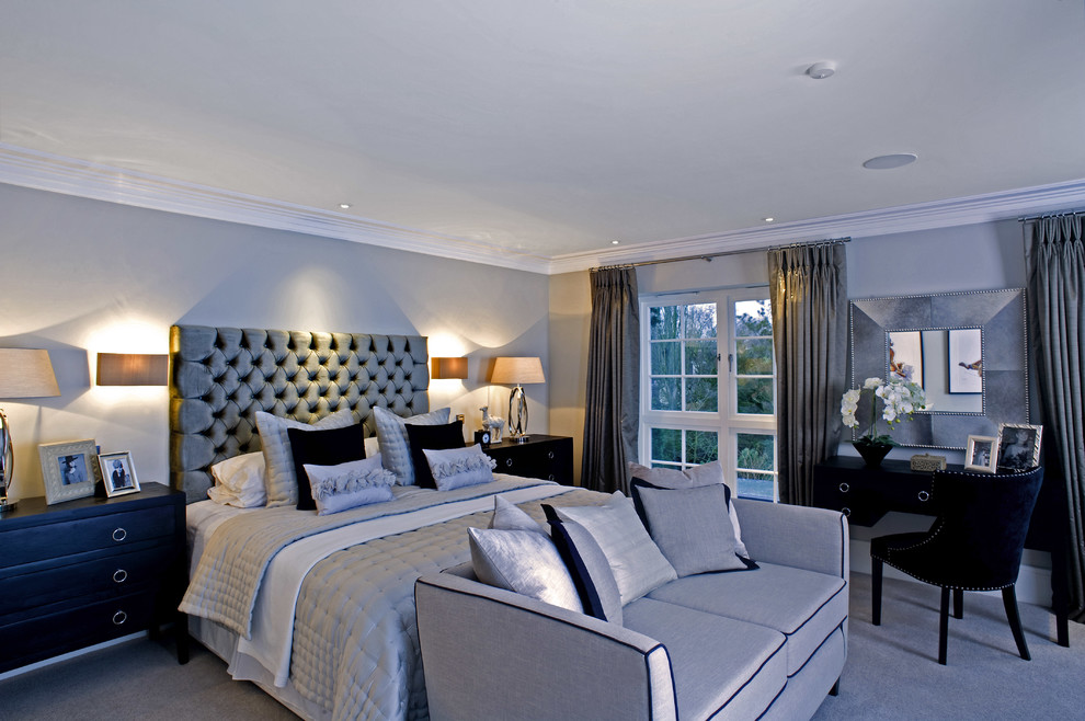 Inspiration for a transitional bedroom in London with grey walls and grey floor.