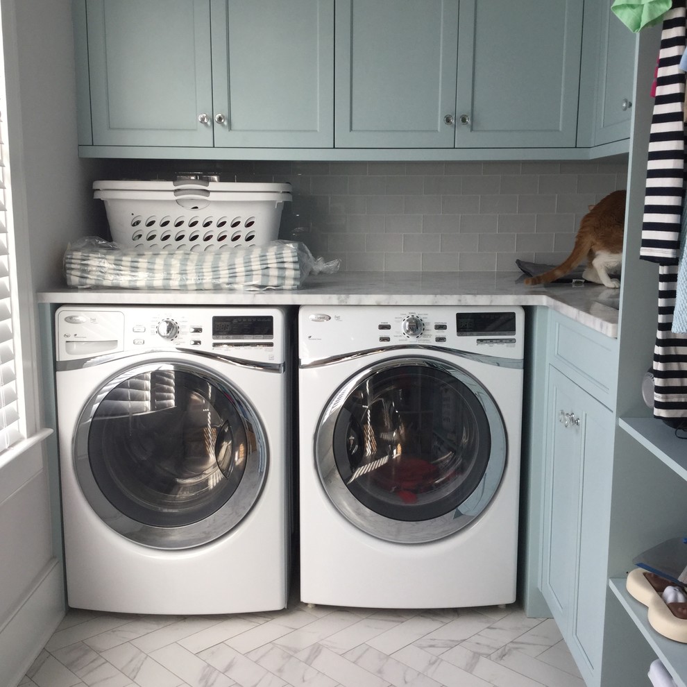 Mid-sized beach style laundry room in Charleston.