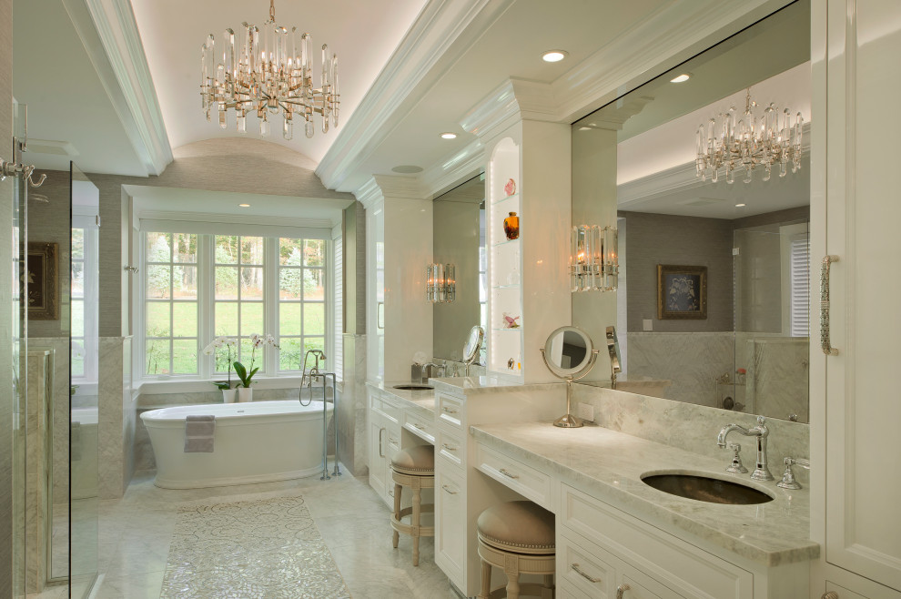 Design ideas for a master bathroom in Baltimore with recessed-panel cabinets, beige cabinets, a freestanding tub, an undermount sink, beige benchtops, a double vanity and a built-in vanity.