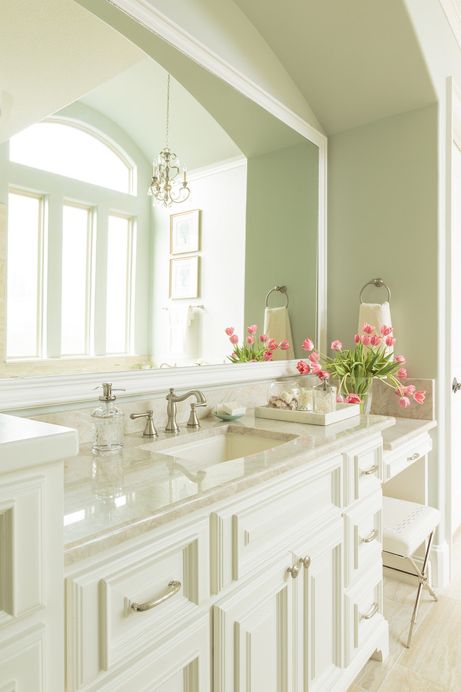 Inspiration for a large traditional master bathroom in Houston with an undermount sink, raised-panel cabinets, white cabinets, quartzite benchtops, beige tile, porcelain tile, porcelain floors and green walls.