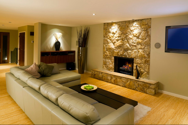 A stone mantel retrofit with an electric fireplace is a safe and energy efficient way to add ambiance to your living room.