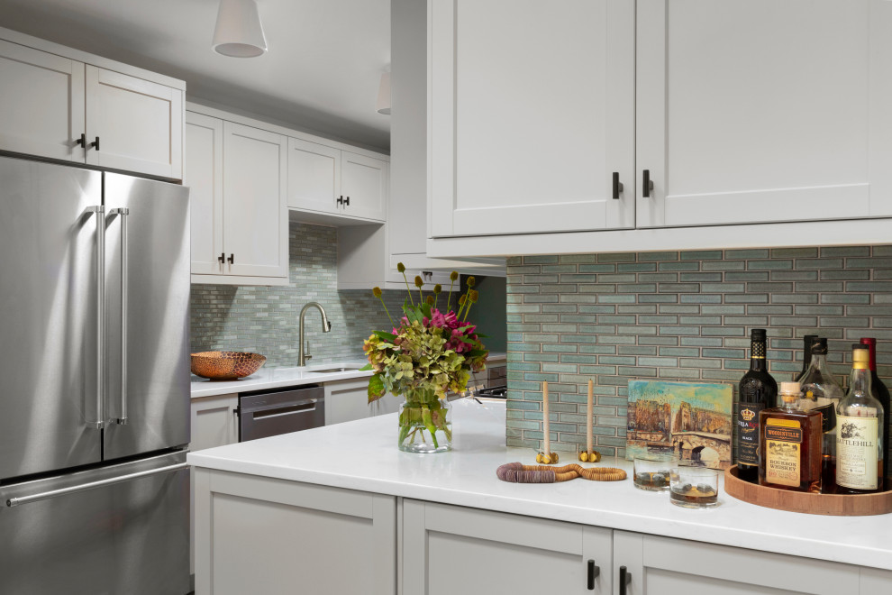 Design ideas for a small transitional galley separate kitchen in Seattle with an undermount sink, shaker cabinets, grey cabinets, quartz benchtops, blue splashback, ceramic splashback, stainless steel appliances, bamboo floors, no island, orange floor and white benchtop.