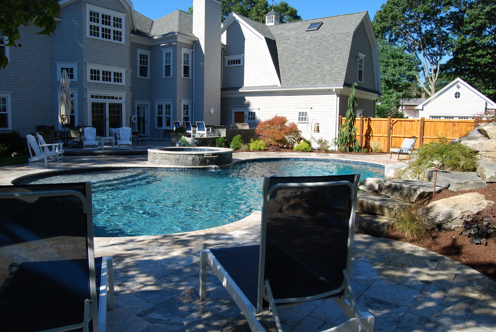 Mid-sized mountain style backyard stone and kidney-shaped natural water slide photo in Boston