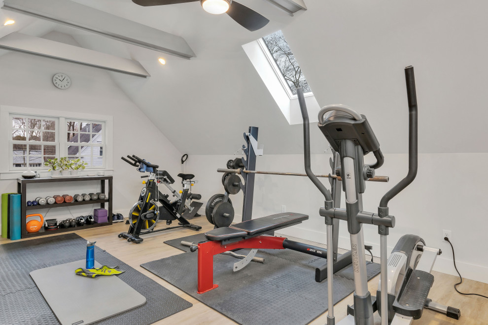 Inspiration for a mid-sized transitional multipurpose gym in Boston with grey walls, vinyl floors, grey floor and exposed beam.