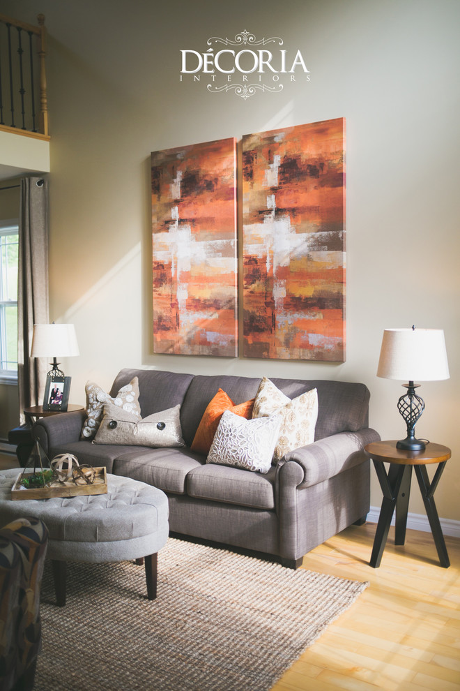 Small transitional formal and open concept light wood floor and beige floor home design photo with beige walls, a standard fireplace and a tv stand