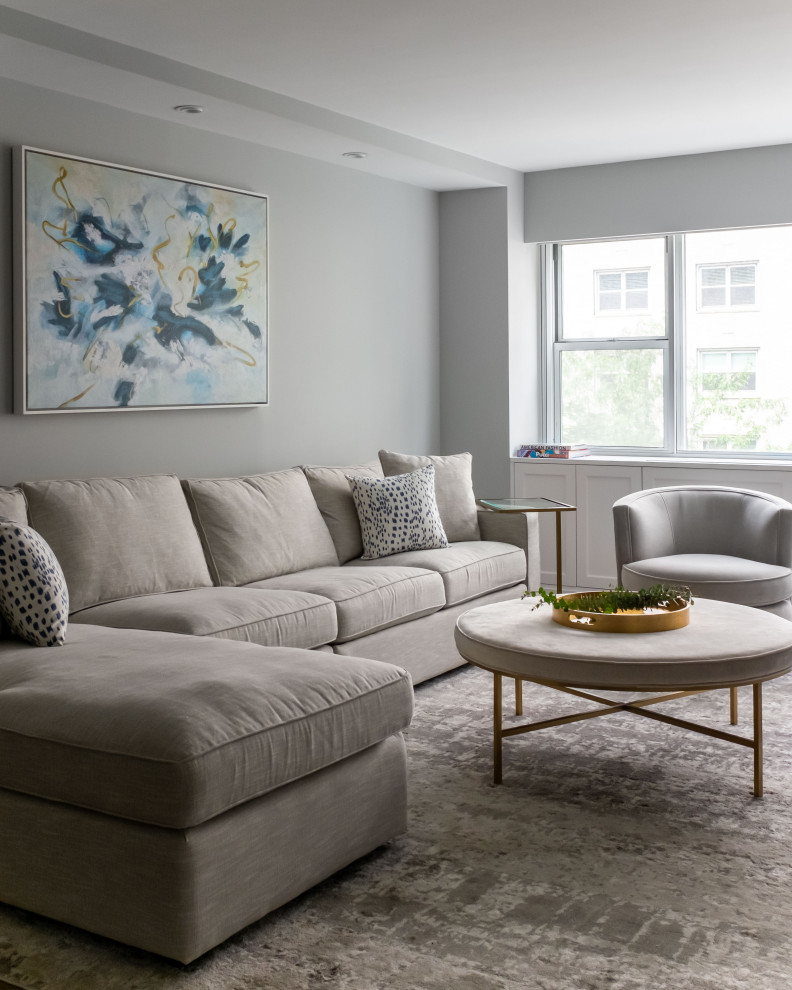 This is an example of a large transitional open concept living room in Miami with grey walls.