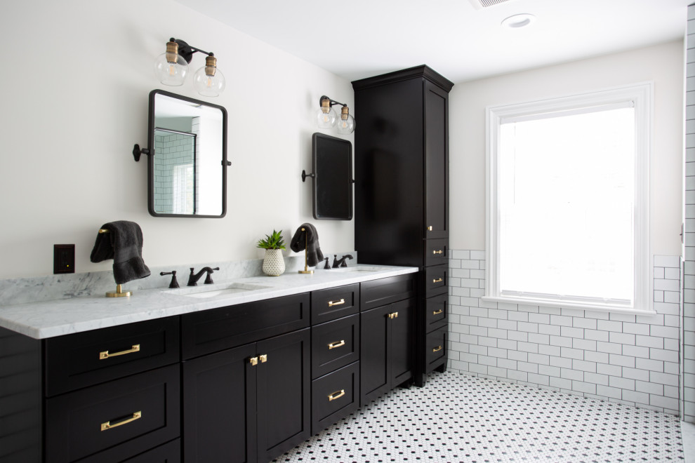 This is an example of a mid-sized transitional master bathroom in Columbus with shaker cabinets, black cabinets, white tile, ceramic tile, white walls, an undermount sink, marble benchtops, white floor, white benchtops, a double vanity, a built-in vanity and mosaic tile floors.