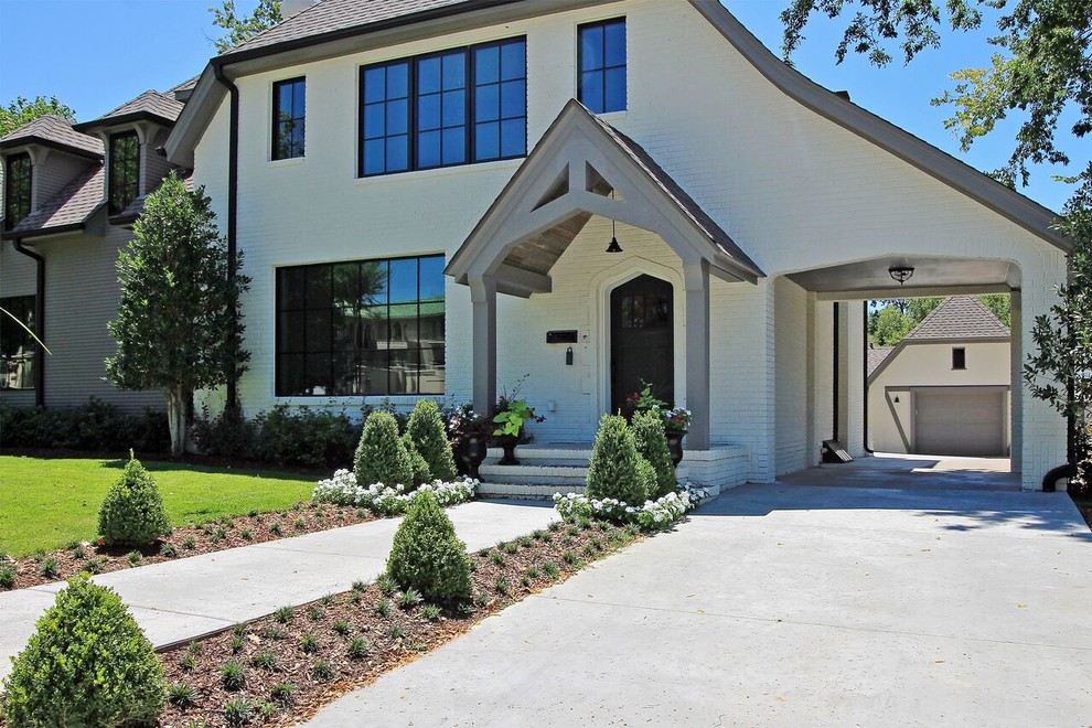 Design ideas for a large and multi-coloured classic two floor brick house exterior in Other with a hip roof.