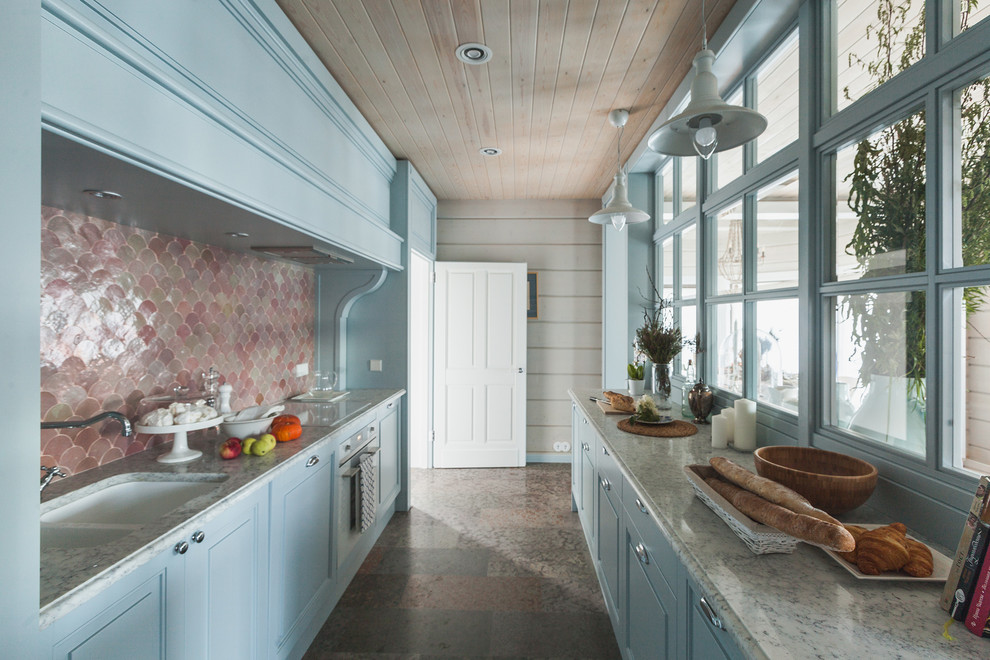 Design ideas for a country galley separate kitchen in Other with an undermount sink, raised-panel cabinets, blue cabinets, brown splashback, white appliances and no island.