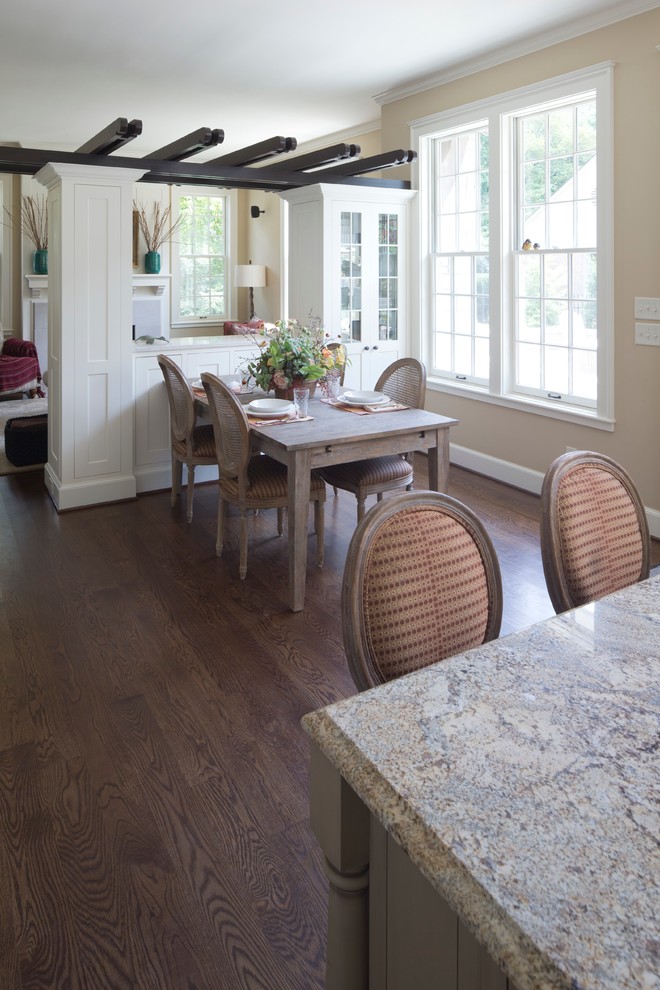 Example of a classic medium tone wood floor eat-in kitchen design in Indianapolis with an island