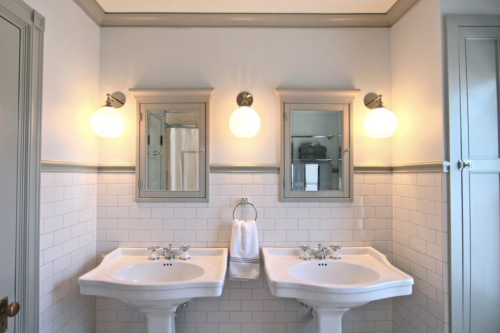 This is an example of a small traditional master bathroom in Boston with a pedestal sink, beaded inset cabinets, grey cabinets, white tile, subway tile and blue walls.