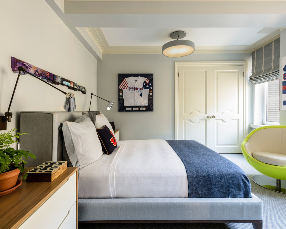 Photo of a mid-sized transitional kids' room for boys in New York with grey walls and carpet.
