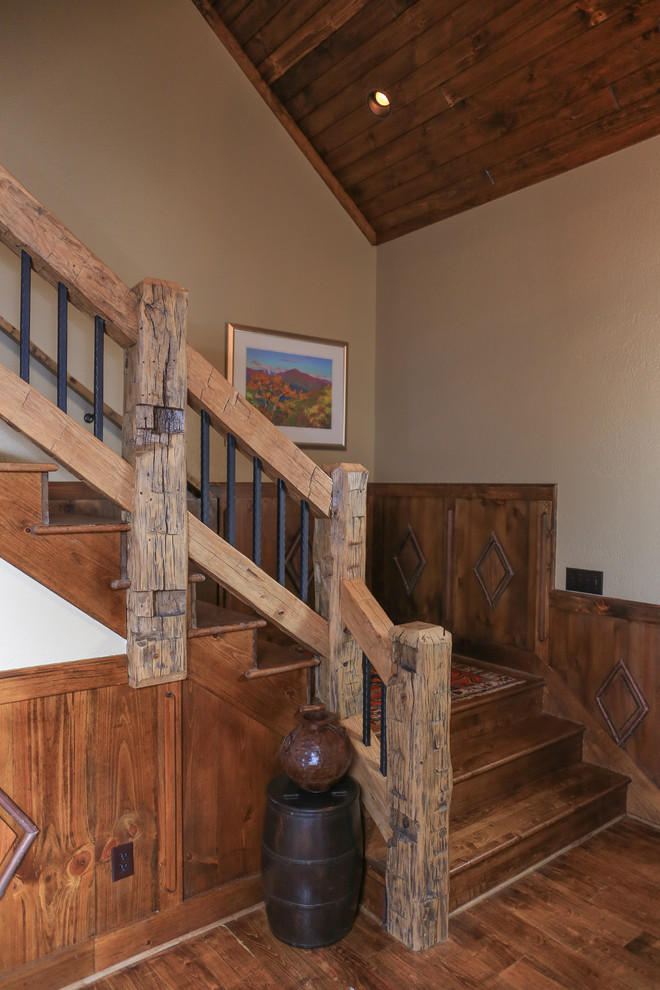 Staircase - huge rustic wooden straight staircase idea in Charlotte with wooden risers