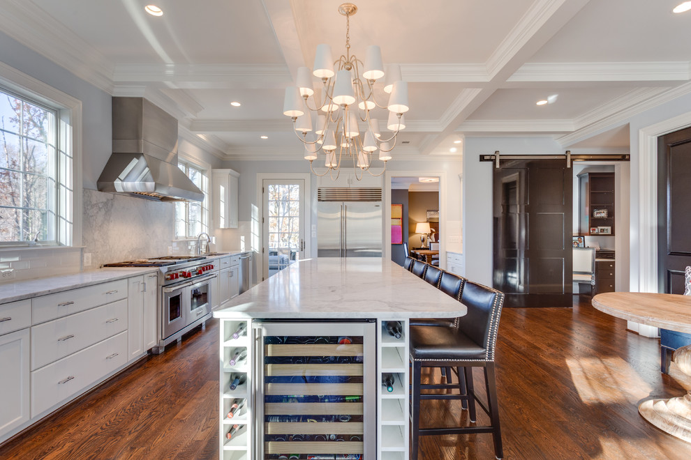 Inspiration for a transitional l-shaped dark wood floor open concept kitchen remodel in DC Metro with an undermount sink, shaker cabinets, white cabinets, marble countertops, gray backsplash, stainless steel appliances, an island and marble backsplash