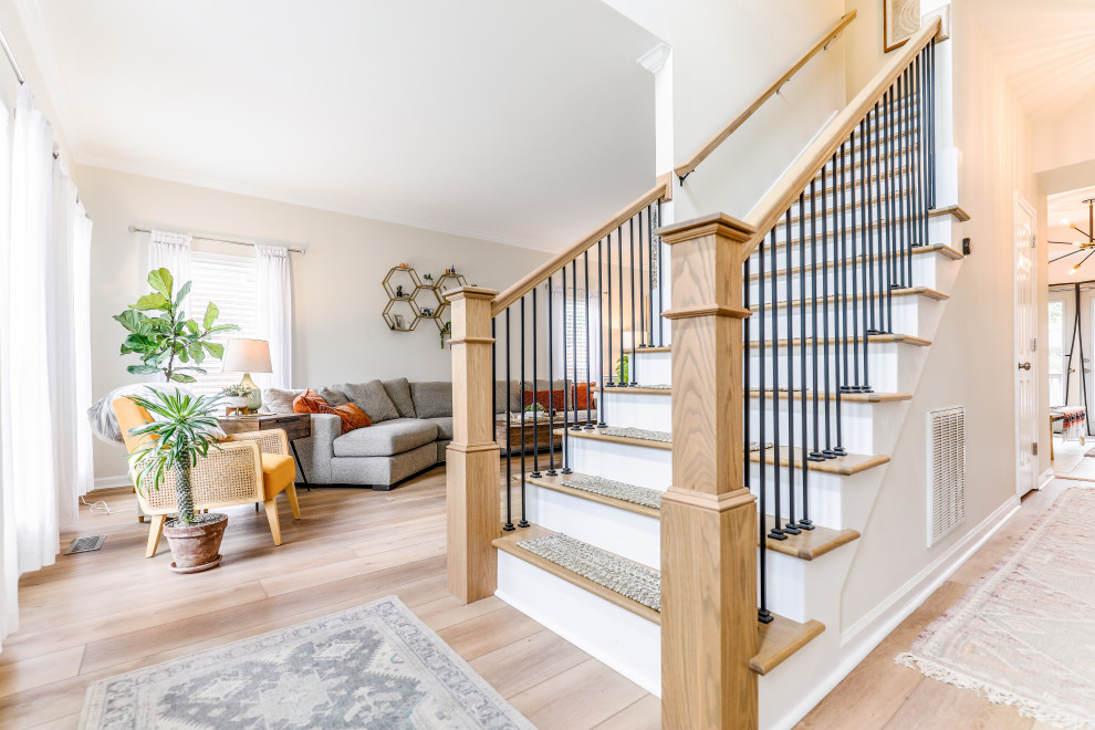 Inspiration for a mid-sized transitional wood straight staircase in Nashville with wood risers and mixed railing.