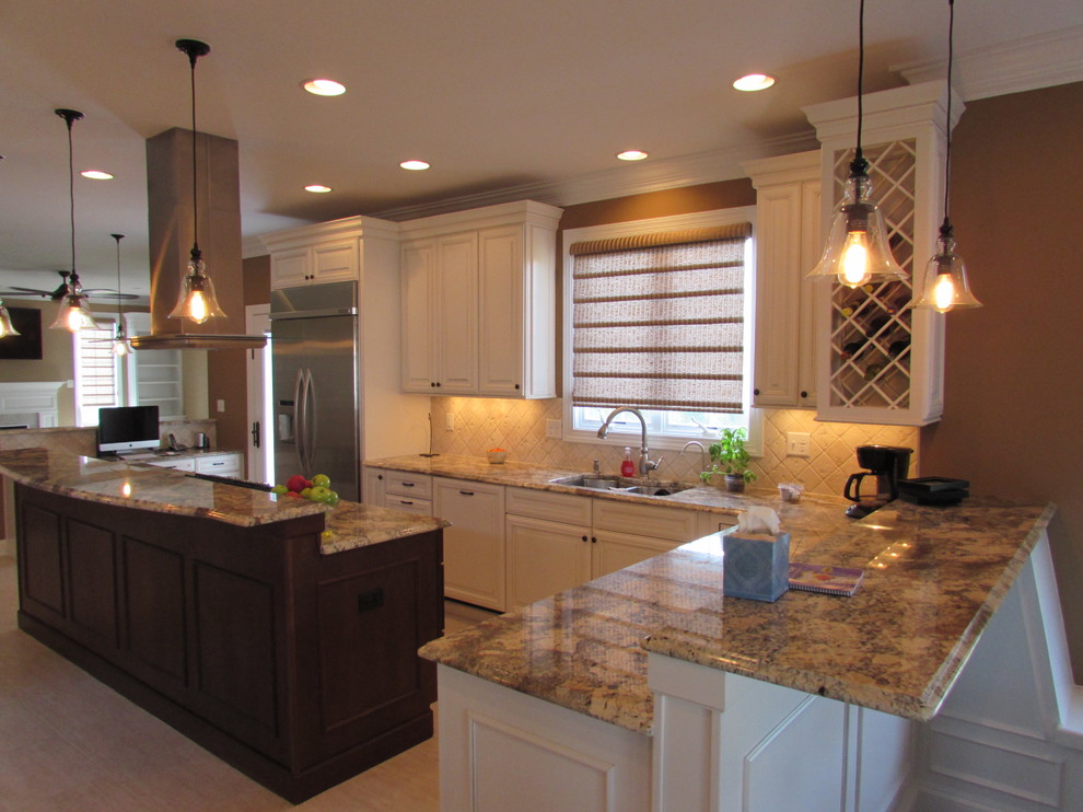 Eat-in kitchen - large transitional l-shaped ceramic tile eat-in kitchen idea in DC Metro with an undermount sink, raised-panel cabinets, white cabinets, granite countertops, beige backsplash, ceramic backsplash, stainless steel appliances and an island