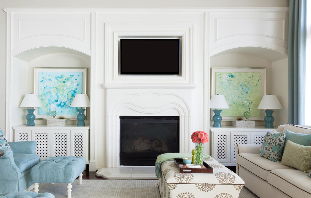 The Davis Home - Family Room - TV wall custom built to fit with decorative features and kids artwork custom framed Wall Color natural cream benjamin moore and white built-ins sherwin williams alabaster.