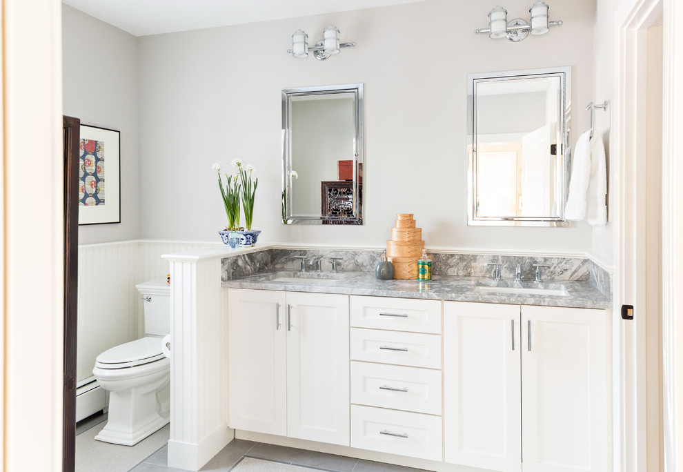 Traditional bathroom in Boston with an undermount sink, shaker cabinets, white cabinets, a two-piece toilet and grey walls.