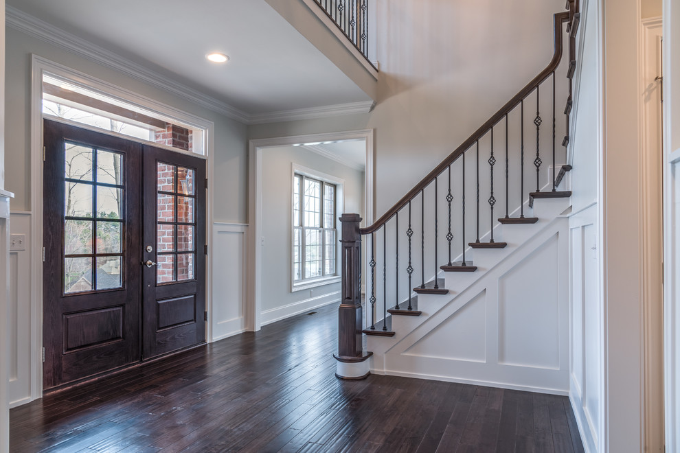 Home design - mid-sized transitional dark wood floor and brown floor home design idea with gray walls and a dark wood front door