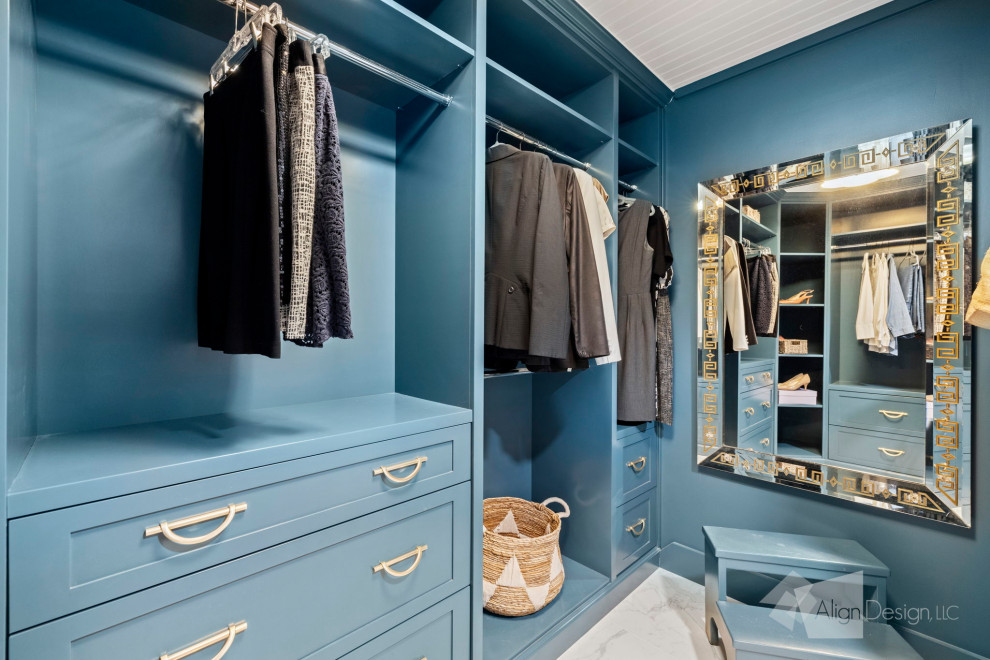 Inspiration for a medium sized traditional gender neutral dressing room in Other with shaker cabinets, blue cabinets, marble flooring, multi-coloured floors and a wood ceiling.