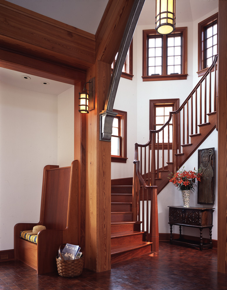 Design ideas for a large arts and crafts wood curved staircase in Philadelphia with wood risers and wood railing.