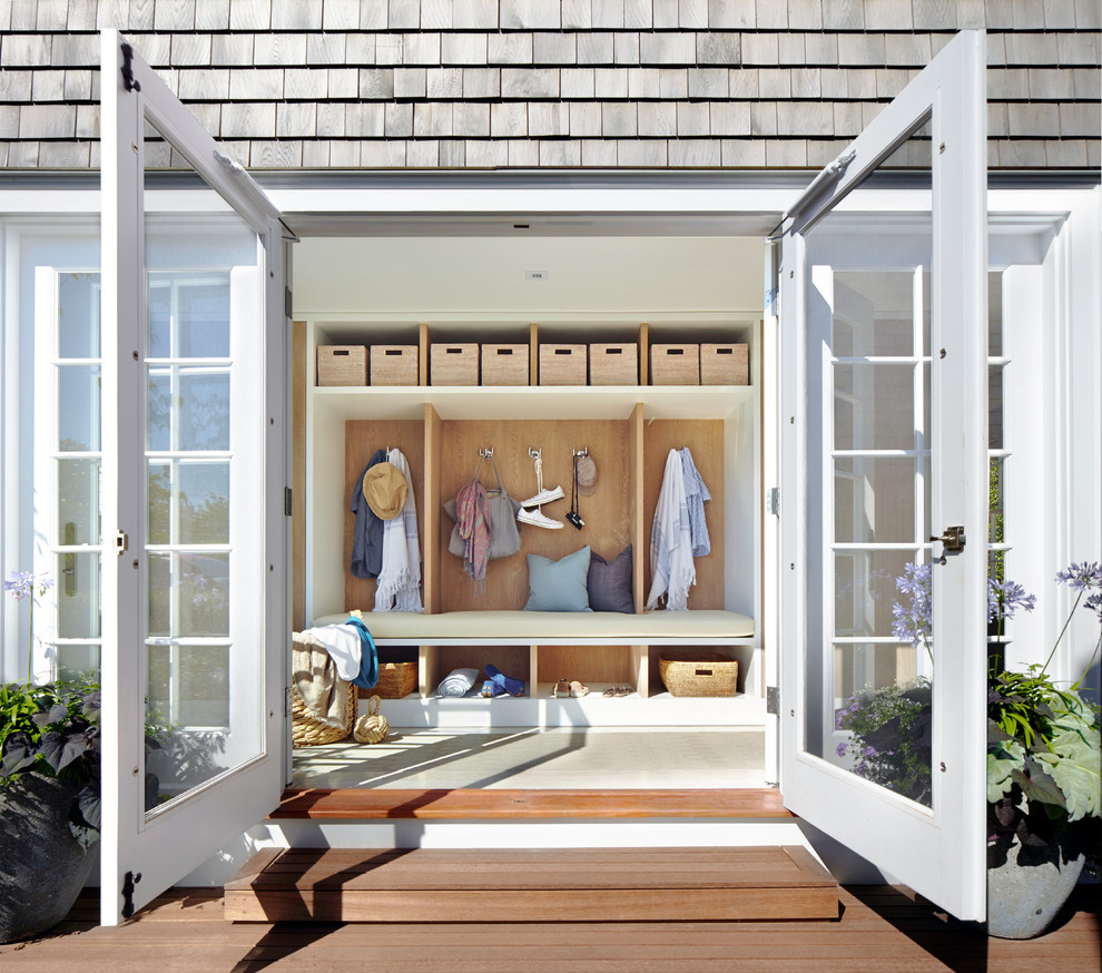 Mid-sized beach style mudroom in Boston with white walls, a double front door, a white front door and ceramic floors.