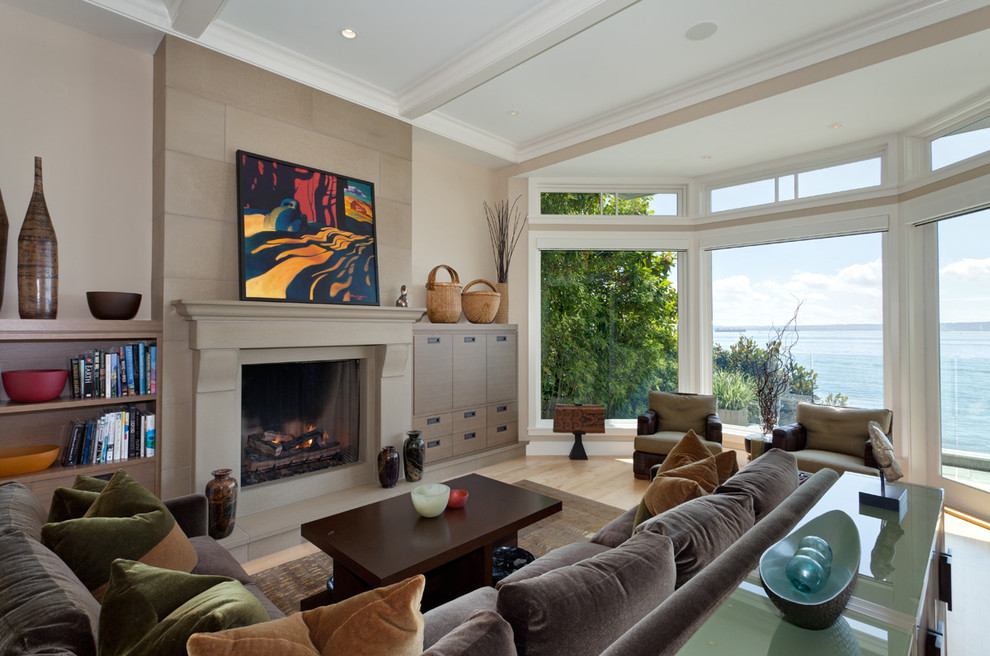 This is an example of an expansive contemporary living room in Vancouver with beige walls, a standard fireplace and no tv.