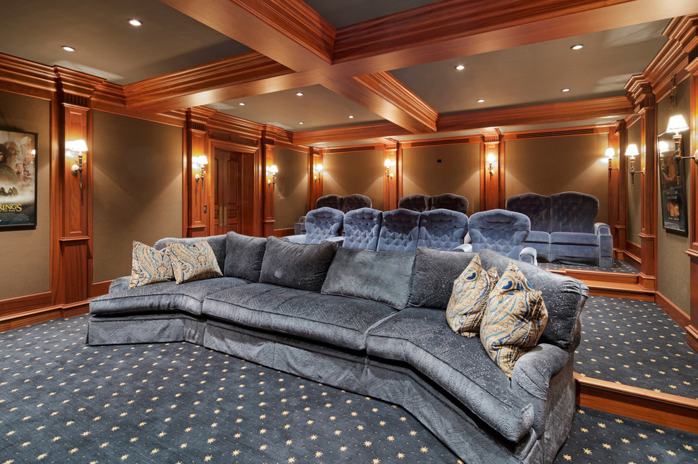 Large traditional enclosed home theatre in Philadelphia with beige walls, carpet, a projector screen and blue floor.