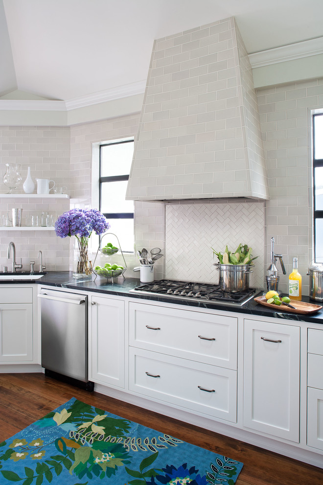 Inspiration for a traditional kitchen in San Francisco with stainless steel appliances, subway tile splashback and soapstone benchtops.