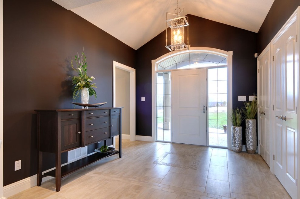 Large contemporary foyer in Other with brown walls, a single front door, a white front door, ceramic floors and beige floor.