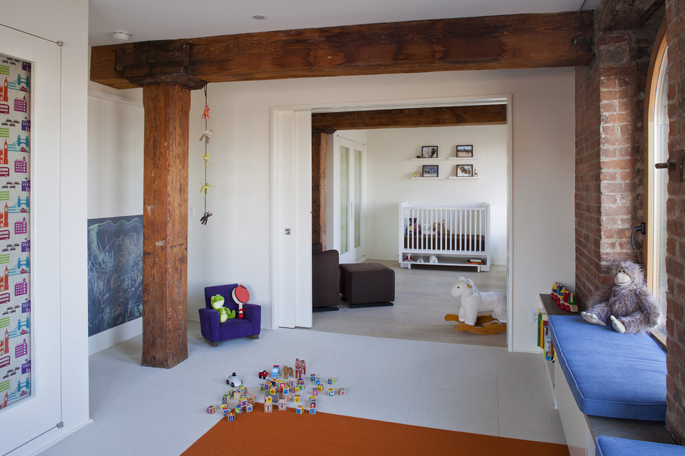 Contemporary gender-neutral nursery in New York with white walls.