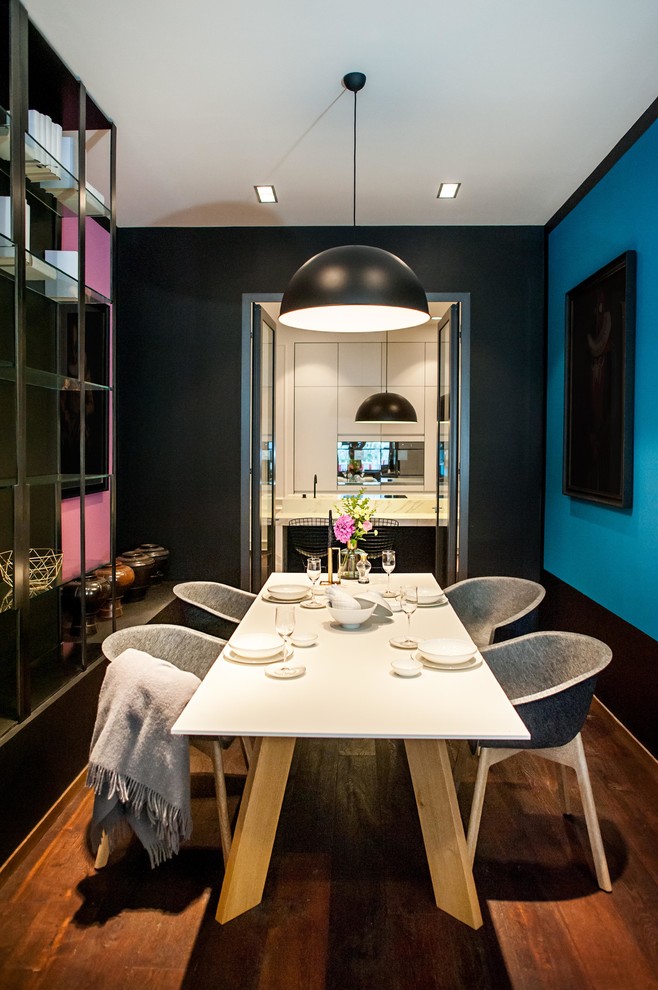 Inspiration for a scandinavian dining room in Dusseldorf with multi-coloured walls and medium hardwood floors.